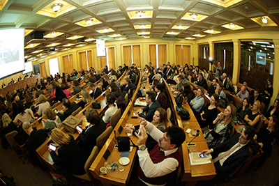 Guests at a conference at the BG of Greece in Athens listening to Attorney Kounoupis speak.